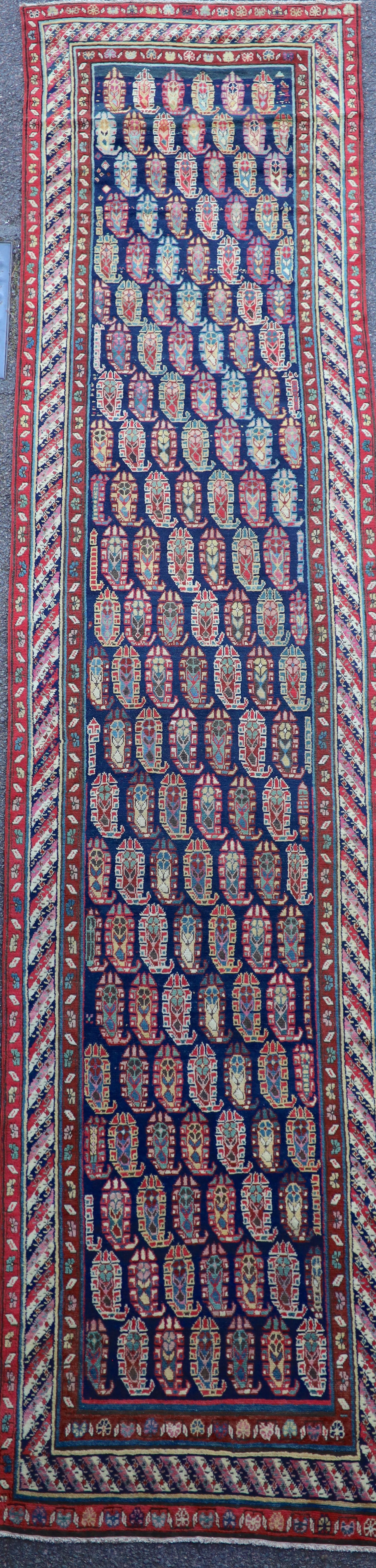 An antique Karabagh blue ground runner, late 19th century 355 x 106